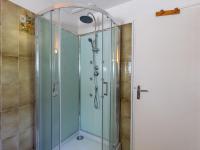 a shower with a glass door in a bathroom at Holiday Home Blaue Hortensie - SZN100 by Interhome in Sizun