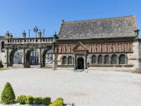 an old stone building with a large courtyard at Holiday Home Blaue Hortensie - SZN100 by Interhome in Sizun