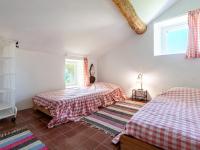 Łóżko lub łóżka w pokoju w obiekcie Holiday Home Maison Penta by Interhome