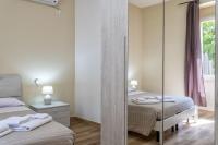 Posteľ alebo postele v izbe v ubytovaní Vico Rooms