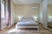 Posteľ alebo postele v izbe v ubytovaní Vico Rooms