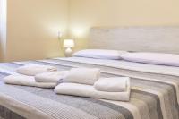 Posteľ alebo postele v izbe v ubytovaní Vico Rooms