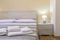 Posteľ alebo postele v izbe v ubytovaní Vico Rooms