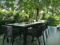 a black table and chairs on a patio at Villa Prima Natura, Imotski private pool in Imotski