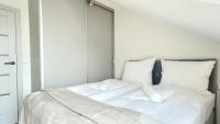 Posteľ alebo postele v izbe v ubytovaní Apartamenty Sun & Snow Posesja Kapitańska