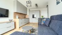 Televízia a/alebo spoločenská miestnosť v ubytovaní Apartamenty Sun & Snow Posesja Kapitańska