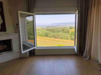 a room with a large window with a view at Villa Casa Chrissy in Plagiárion