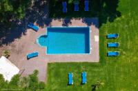 an overhead view of a swimming pool in a yard at Cortijo El Indiviso in Vejer de la Frontera