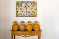 a group of four vases sitting on a table at Cortijo El Indiviso in Vejer de la Frontera