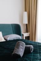Posteľ alebo postele v izbe v ubytovaní Butique Apartman