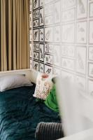 Posteľ alebo postele v izbe v ubytovaní Butique Apartman