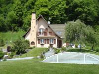 a house with a swimming pool in front of it at GÏTE LA DANSE DES BICHES in Ranspach