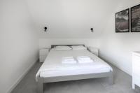 Łóżko lub łóżka w pokoju w obiekcie Apartamenty Zielona Lipka
