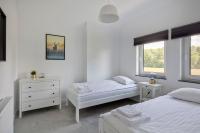 Łóżko lub łóżka w pokoju w obiekcie Apartamenty Zielona Lipka