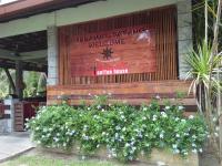 a sign for a restaurant with a bunch of flowers at Hotel Felda Residence Hot Springs in Sungkai