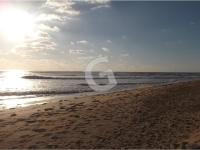 a beach with footprints in the sand and the ocean at Appartement La Tranche-sur-Mer, 3 pièces, 5 personnes - FR-1-357-309 in La Tranche-sur-Mer