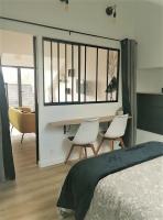 Łóżko lub łóżka w pokoju w obiekcie Gîte La Terrasse du 37