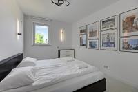 Posteľ alebo postele v izbe v ubytovaní Dom & House - Apartamenty Sunrise