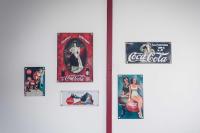 a group of coca cola posters on a refrigerator at Studio cosy proche centre-ville et gare in Mulhouse