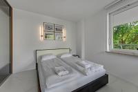 Posteľ alebo postele v izbe v ubytovaní Dom & House - Apartamenty Sunrise