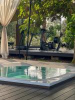 a swimming pool in the middle of a patio with a camera at Hotel Rural Xereca in Puig D’en Valls