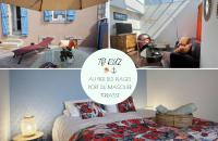 a bedroom with a bed and a living room at 30 m des Plages - Port du Magouër - 6 invités in Plouhinec
