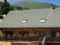 a house with potted plants on a balcony at Chalet Valloire, 6 pièces, 12 personnes - FR-1-263-156 in Valloire