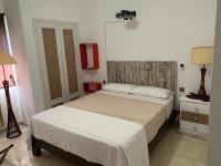 Postel nebo postele na pokoji v ubytování Apartamentos en Playa de Samil Primera Línea de playa Pe Na Areia