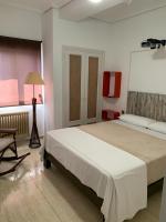 Postel nebo postele na pokoji v ubytování Apartamentos en Playa de Samil Primera Línea de playa Pe Na Areia