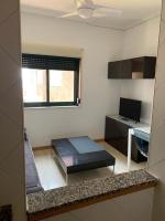 TV a/nebo společenská místnost v ubytování Apartamentos en Playa de Samil Primera Línea de playa Pe Na Areia