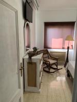 TV a/nebo společenská místnost v ubytování Apartamentos en Playa de Samil Primera Línea de playa Pe Na Areia