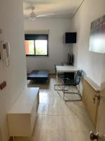 TV a/nebo společenská místnost v ubytování Apartamentos en Playa de Samil Primera Línea de playa Pe Na Areia