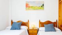 Postel nebo postele na pokoji v ubytování Home Victoria Playa Málaga