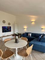 A seating area at Sardegna Costa Corallina Appartamento Luxury Vista Mare in splendido villaggio - IUN R6511