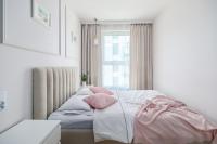 Łóżko lub łóżka w pokoju w obiekcie Unique Apartments - Angielska Grobla