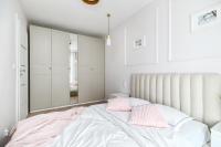 Łóżko lub łóżka w pokoju w obiekcie Unique Apartments - Angielska Grobla