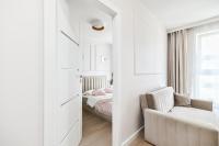 Łóżko lub łóżka w pokoju w obiekcie Unique Apartments - Angielska Grobla