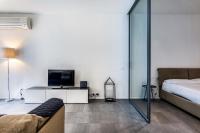 Posteľ alebo postele v izbe v ubytovaní San Maurilio Apartment