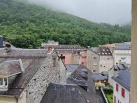 an aerial view of a city with buildings and a mountain at Appartement Cauterets, 2 pièces, 4 personnes - FR-1-234-299 in Cauterets