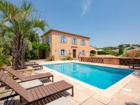 a villa with a swimming pool and a house at Holiday Home La Bastide Rose by Interhome in Sainte-Maxime
