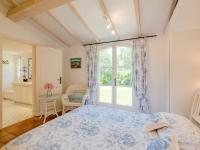 a bedroom with a bed and a large window at Holiday Home La Bastide Rose by Interhome in Sainte-Maxime