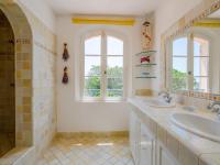 a bathroom with two sinks and two windows at Holiday Home La Bastide Rose by Interhome in Sainte-Maxime
