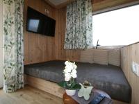 Televízia a/alebo spoločenská miestnosť v ubytovaní Apartment Kröll by Interhome