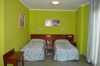 Posteľ alebo postele v izbe v ubytovaní Hotel Don Pelayo