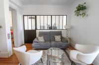 a living room with a couch and two chairs at Charming and luminous 2br with balcony - Boulogne-Billancourt - Welkeys in Boulogne-Billancourt