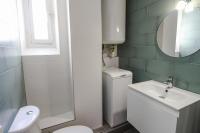 a bathroom with a toilet and a sink and a mirror at Charming and luminous 2br with balcony - Boulogne-Billancourt - Welkeys in Boulogne-Billancourt