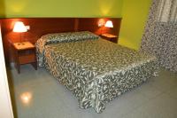 Posteľ alebo postele v izbe v ubytovaní Hotel Don Pelayo