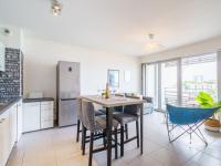 a kitchen with a table and chairs in a room at Apartment Rivadour 2 by Interhome in Bayonne
