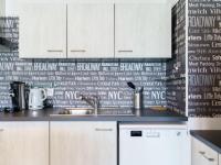 a kitchen with a sink and a wall with writing on it at Apartment Rivadour 2 by Interhome in Bayonne