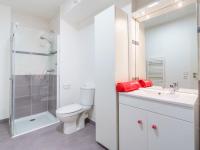 a bathroom with a toilet and a shower and a sink at Apartment Rivadour 2 by Interhome in Bayonne